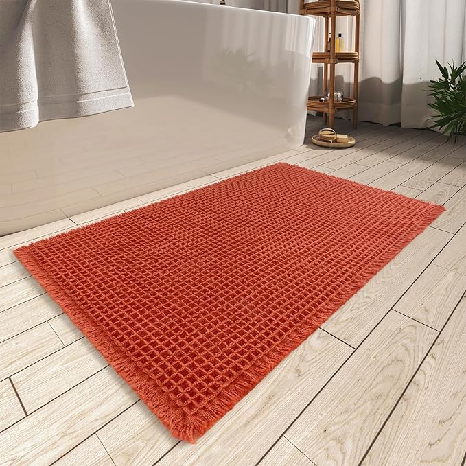 AMOAMI Upgraded Waffle Bath Mat, Super Absorbent Non Slip Bath Mats for Bathroom Floor, Machine Washable Bathroom Rugs with Tassels, Rubber Backed Bathroom Mats, Ultra Soft, 17" x 24", Orange